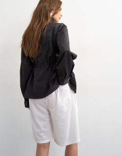 Model wearing Sport stripe detail shorts in ecru