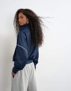 Model wearing Sports high neck piped jacket in navy