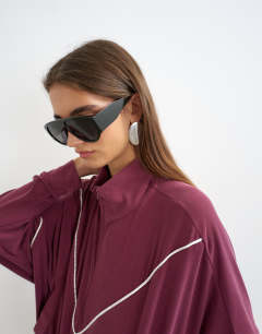 Model wearing Sporty piping half zip top in burgundy