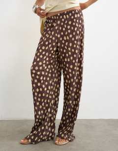Model wearing Spot plisse wide leg trouser in brown