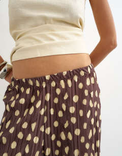 Model wearing Spot plisse wide leg trouser in brown