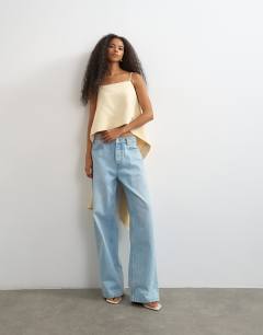 Model wearing Square neck cami with drape back detail in natural