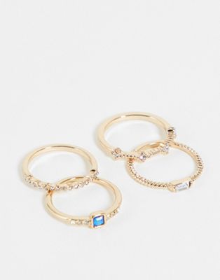 Topshop squared crystal layered 4 x multipack rings in gold and blue