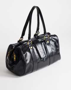 Model wearing Star hardware detail bowler shoulder bag in black
