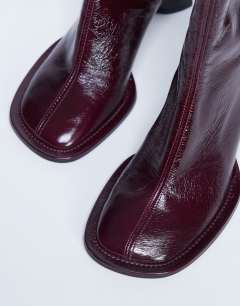 Model wearing Star Premium leather round toe block heel boot in burgundy