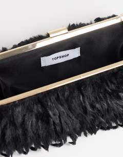 Model wearing Steele small faux feather shoulder bag in black