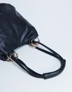 Model wearing Steffie shoulder bag with ring detail in black