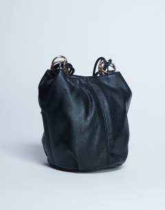 Model wearing Steffie shoulder bag with ring detail in black