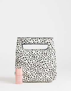 Model wearing Stella hair on real leather small grab bag in dalmatian print