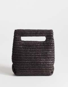 Model wearing Stella straw small grab bag in chocolate