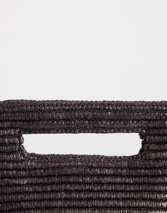 Model wearing Stella straw small grab bag in chocolate