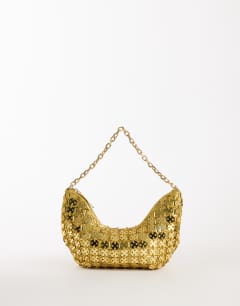 Model wearing Stellan sequin medium scoop shoulder bag in gold