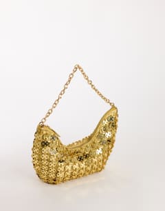 Model wearing Stellan sequin medium scoop shoulder bag in gold