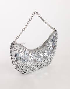 Model wearing Stellan sequin medium scoop shoulder bag in silver