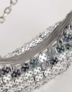 Model wearing Stellan sequin medium scoop shoulder bag in silver