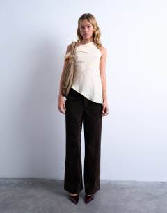 Model wearing Sterling real suede scoop shoulder bag in beige