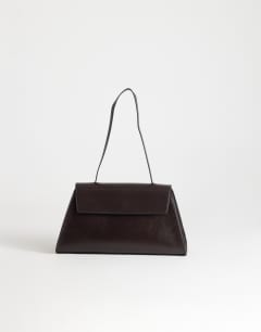 Model wearing Stevey shoulder bag in chocolate