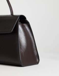 Model wearing Stevey shoulder bag in chocolate