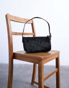 Model wearing Stina hair on real leather shoulder bag in chocolate