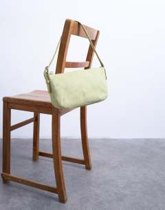 Model wearing Stina hair on real leather shoulder bag in green