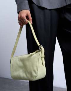 Model wearing Stina hair on real leather shoulder bag in green