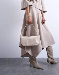 Model wearing Stina real leather shoulder bag in off white pony