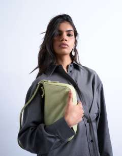Model wearing Stina small hair on real leather shoulder bag in green