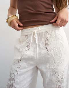Model wearing Straight broderie trouser in ecru