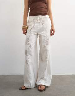 Model wearing Straight broderie trouser in ecru