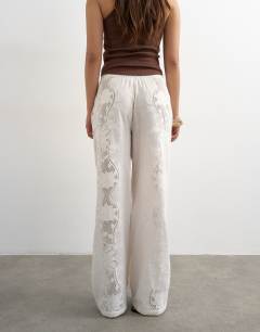 Model wearing Straight broderie trouser in ecru
