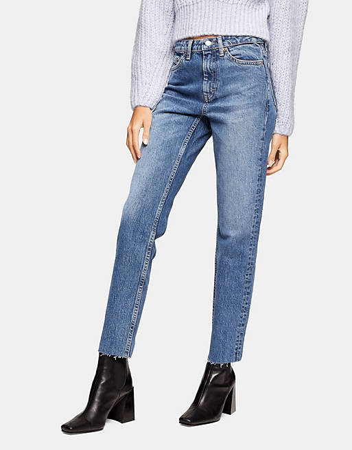 Topshop straight jeans with ripped hems in mid blue
