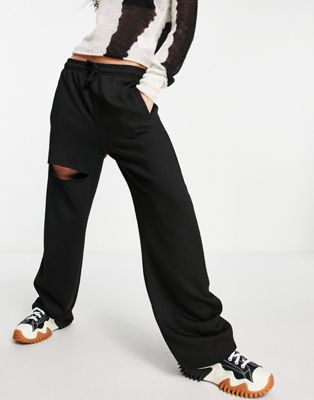 Topshop straight leg jogger with leg rip in black