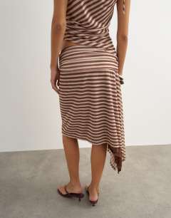 Model wearing Stripe asymmetric skirt in brown