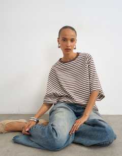 Model wearing Stripe batwing t-shirt in chocolate