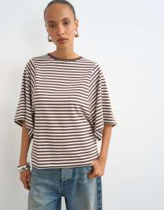 Model wearing Stripe batwing t-shirt in chocolate