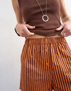 Model wearing Stripe boxer short in orange