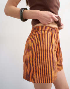 Model wearing Stripe boxer short in orange