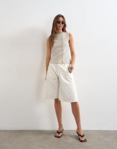 Model wearing Stripe button through vest in ivory and black