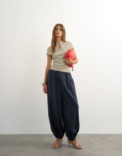 Model wearing Stripe cap sleeve top in blue