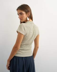 Model wearing Stripe cap sleeve top in blue