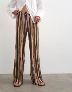 Model wearing Stripe crinkle tie waist wide leg trouser in pink