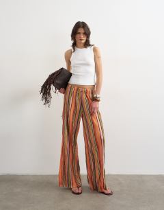 Model wearing Stripe crinkle tie waist wide leg trousers in orange