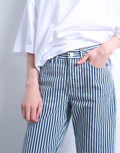 Model wearing Stripe cropped mid rise straight leg trouser in blue