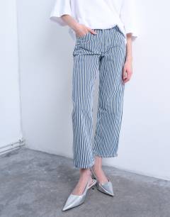 Model wearing Stripe cropped mid rise straight leg trouser in blue