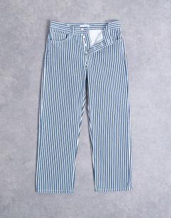 Model wearing Stripe cropped mid rise straight leg trouser in blue