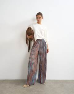 Model wearing Stripe drawstring crinkle trouser in brown