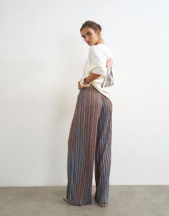 Model wearing Stripe drawstring crinkle trouser in brown