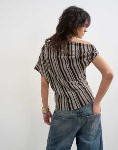 Model wearing Stripe fallen shoulder textured top in grey