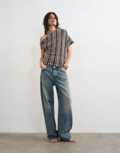 Model wearing Stripe fallen shoulder textured top in grey