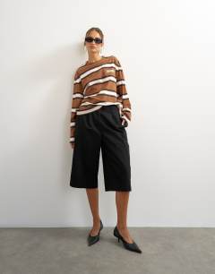 Model wearing Stripe graphic Copenhagen skater tee in brown